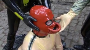 Latex Couple with Rubber Slave in Transparent Catsuit Drinking Femdom Piss