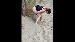 Nervous Woman Caught Peeing in Public at the Beach