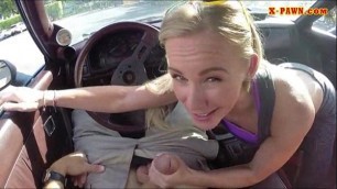 Blonde bimbo gives a road head while test driving her car